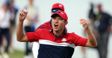 United State's Collin Morikawa celebrates on the 17th green after winning the hole to go 1up and guarantee the half point needed for the U.S. to win during Sunday Singles Matches of the 43rd Ryder Cup at Whistling Straits, in Kohler, Wisconsin, Sept. 26, 2021.