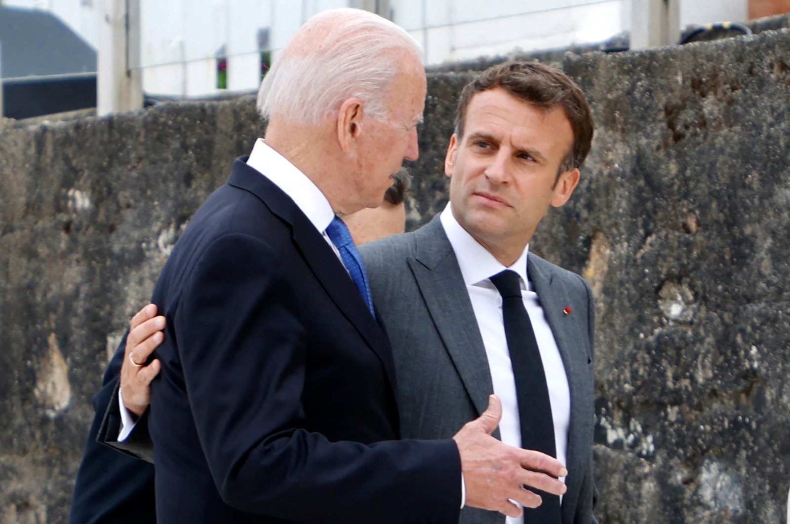 U.S. President Joe Biden (L) and French President Emmanuel Macron speak after the family photo at the start of the G-7 summit in Carbis Bay, Cornwall, Britain, June 11, 2021. (AFP Photo)