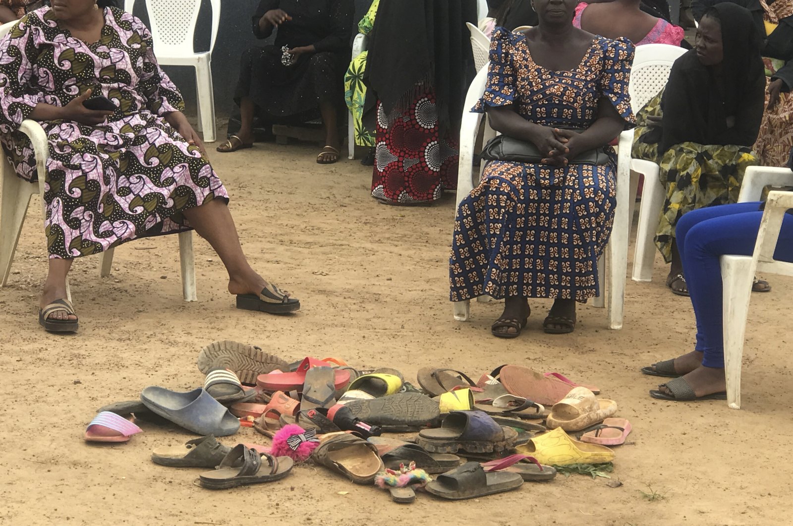 Parents of abducted schoolchildren of the Bethel Baptist High School wait for news of their children in Damishi, Kaduna, Nigeria, July 6, 2021. (AP Photo)
