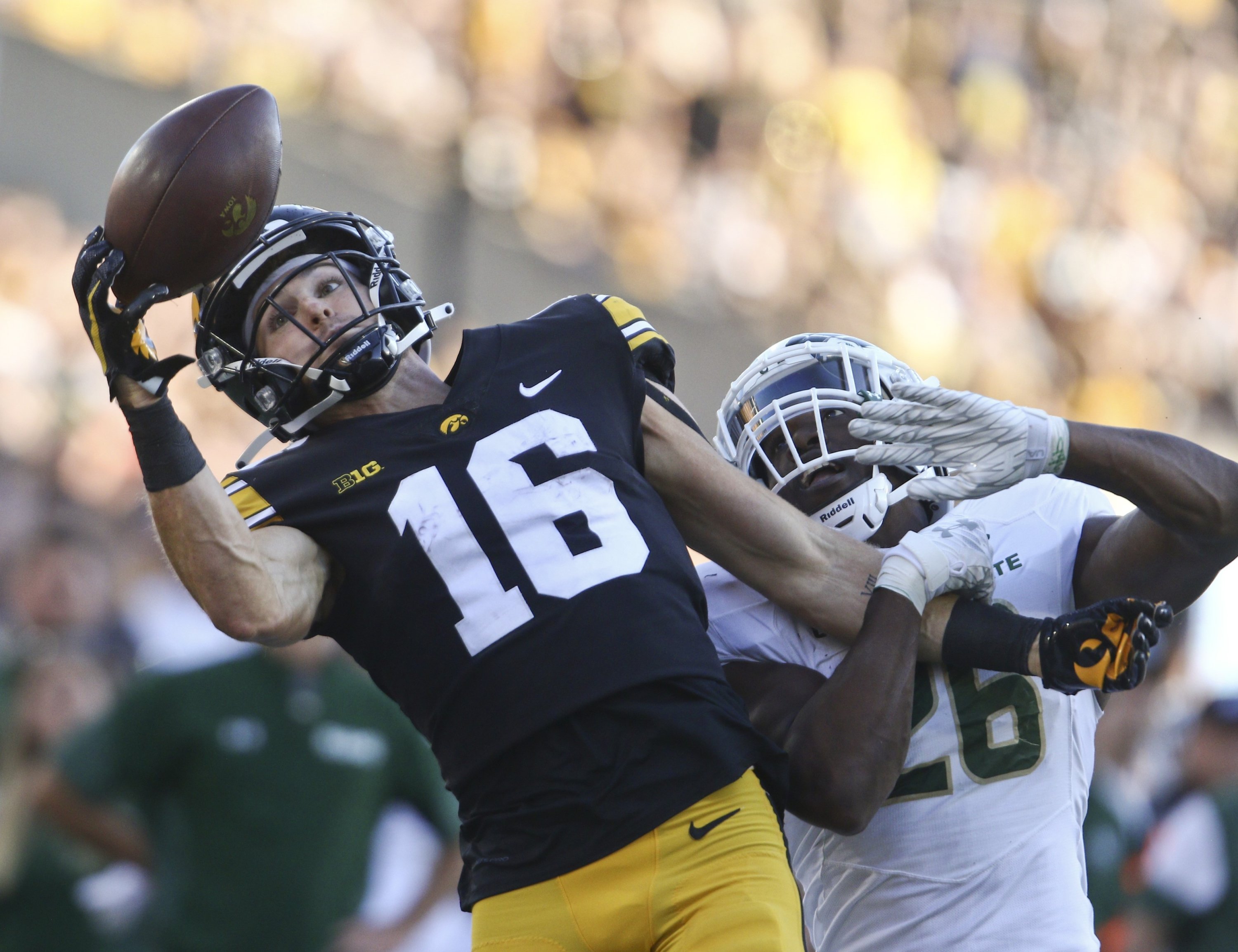 Wide receiver Charlie Jones (16) of the Iowa Hawkeyes has a pass broken up during the second half by defensive back Marshaun Cameron (26) of the Colorado State Rams at Kinnick Stadium, Iowa City, Iowa, U.S., Sept. 25, 2021. (AFP Photo)