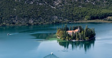 If you want to escape the hustle and bustle at Croatia's Krka National Park, you can catch a boat to the monastery island of Visovac. (Franziska Gabbert/dpa Photo) 