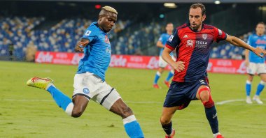 Napoli's Victor Osimhen (L) tries to shoot past Cagliari's Diego Godin during a Serie A match at the Diego-Maradona stadium in Naples, Italy, Sept. 26, 2021. (AFP Photo)