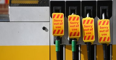 Out of use signs are displayed on fuel pumps in a Shell garage in Muswell Hill in London, Britain, Sept. 27, 2021. (EPA Photo)