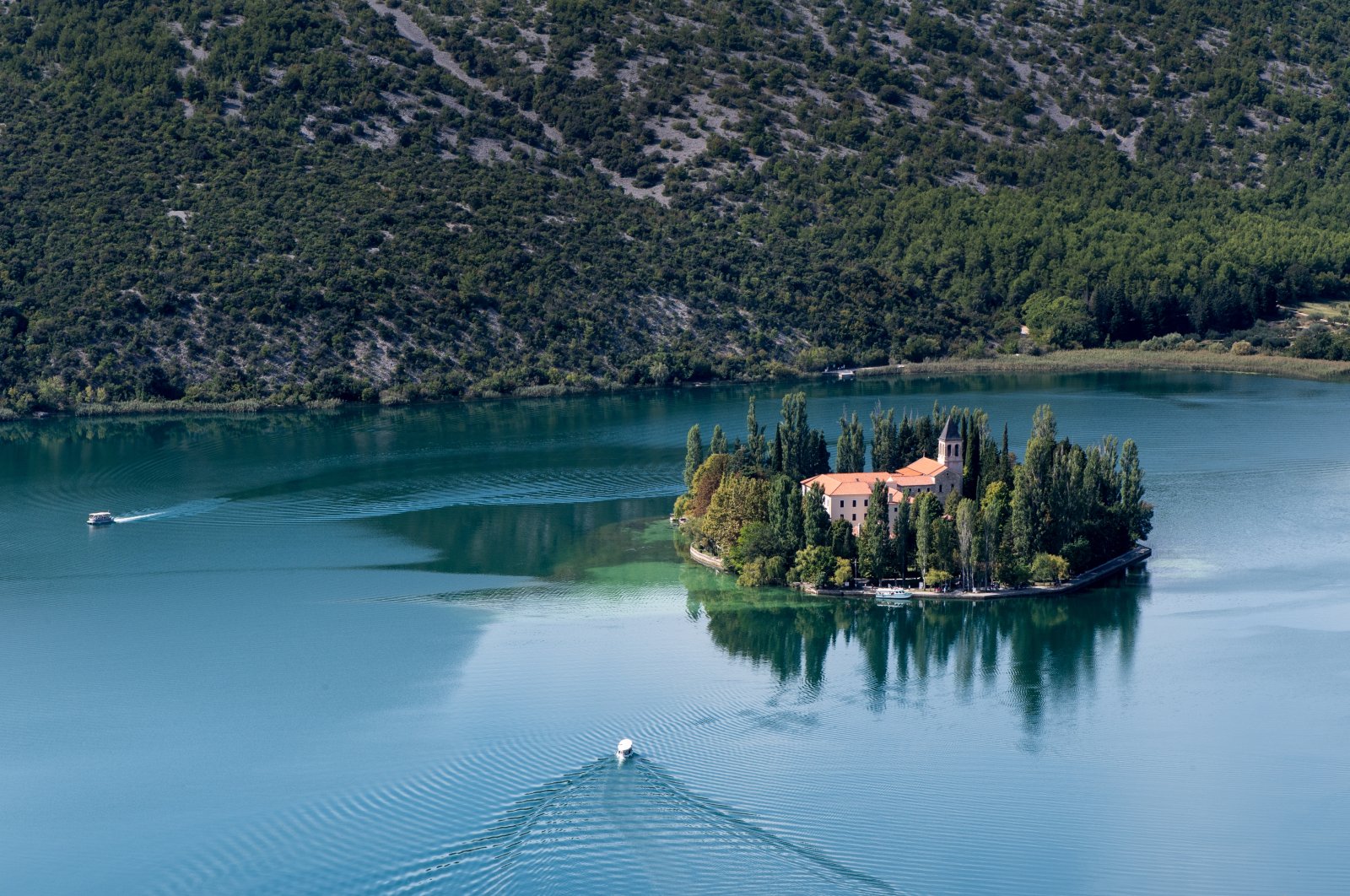 If you want to escape the hustle and bustle at Croatia's Krka National Park, you can catch a boat to the monastery island of Visovac. (Franziska Gabbert/dpa Photo) 