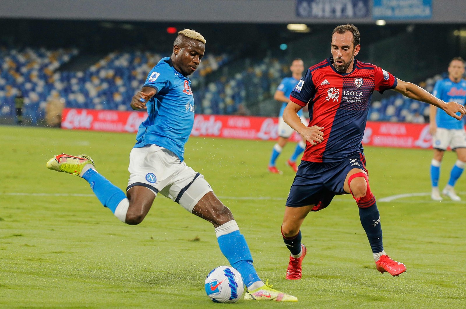 Napoli's Victor Osimhen (L) tries to shoot past Cagliari's Diego Godin during a Serie A match at the Diego-Maradona stadium in Naples, Italy, Sept. 26, 2021. (AFP Photo)
