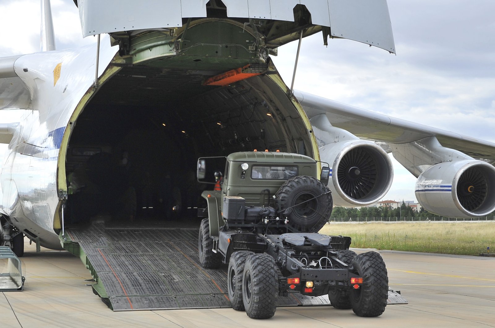 Military vehicles, equipment and parts of the S-400 air defense systems are unloaded from a Russian transport aircraft, at Mürted military airport in Ankara, Turkey, July 12, 2019. (AP Photo)