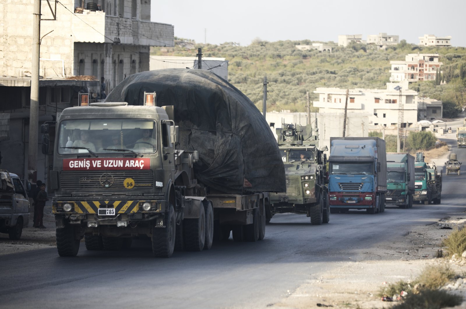 A Turkish military convoy drives through the village of Urum al-Jawz, in Idlib province, Syria, Oct. 20, 2020. (AP File Photo)
