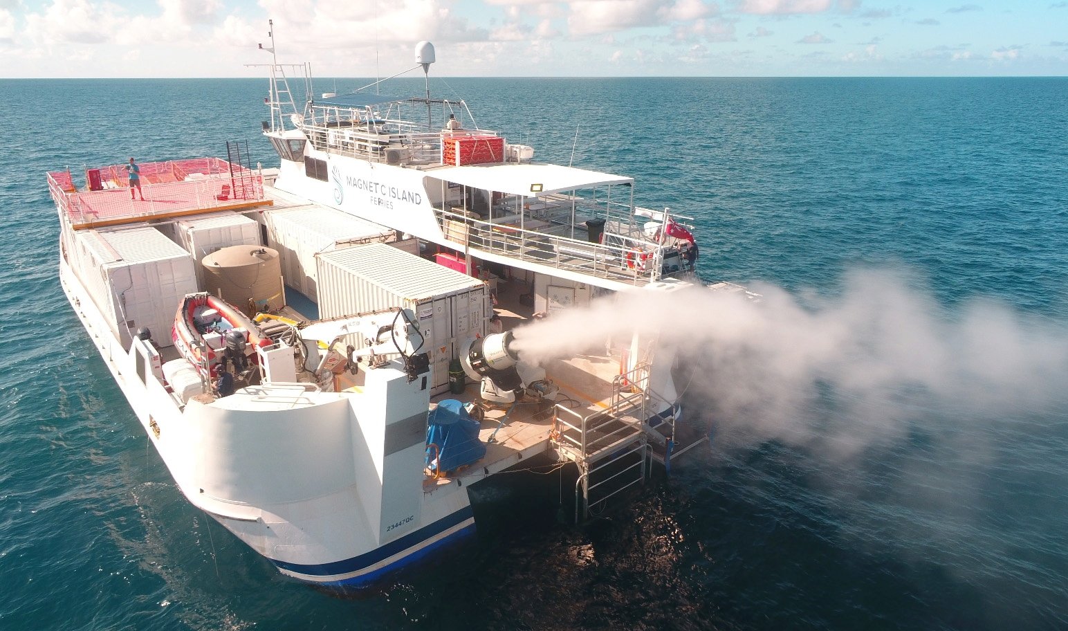 Plume from sprayer jets on a vessel is seen during the second field trial at Broadhurst Reef on the Great Barrier Reef, Queensland, Australia, March, 2021. (Southern Cross University via Reuters)