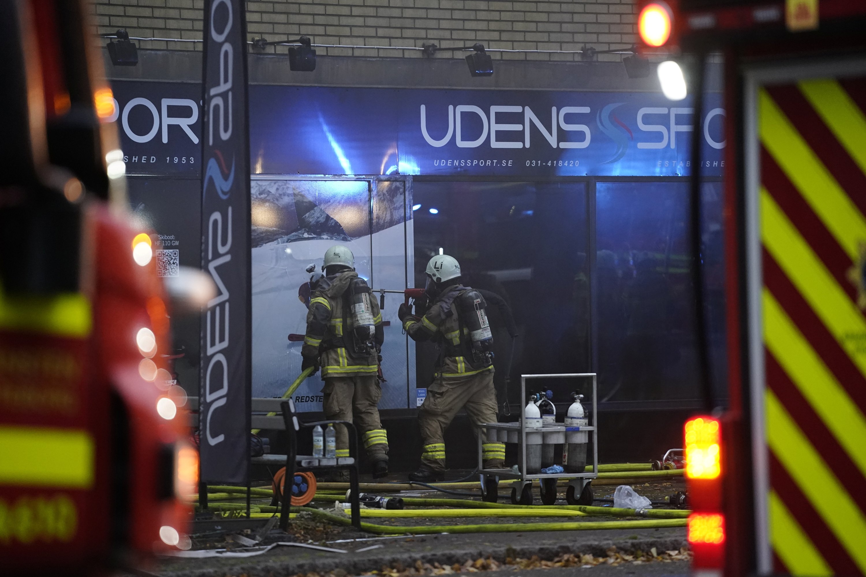 An emergency services crew works to evacuate people and put out a fire after an explosion hit an apartment building in Annedal, central Gothenburg, Sweden, Sept. 28, 2021. (Reuters Photo)