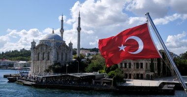 A Turkish flag is pictured on a boat with the Ortaköy Mosque in the background in Istanbul, Turkey, Sep. 5, 2021. (Reuters Photo)