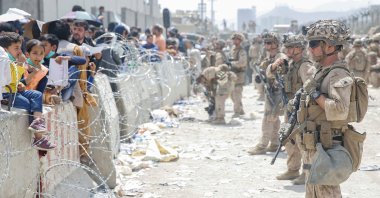 U.S. Marines provide assistance during an evacuation at Hamid Karzai International Airport, in Kabul, Afghanistan, Aug. 20, 2021. (REUTERS Photo)