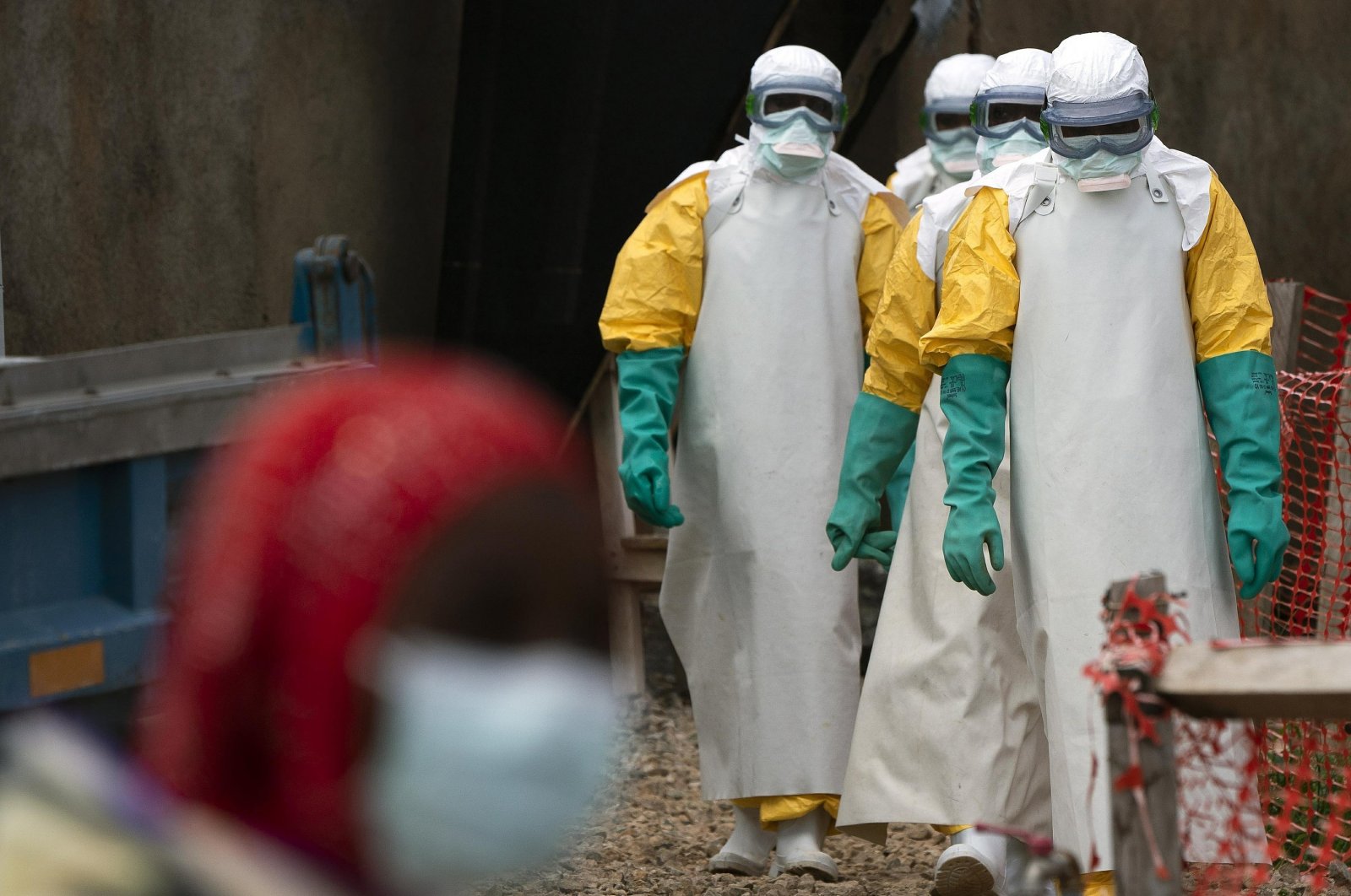 Health workers dressed in protective gear begin their shift at an Ebola treatment center in Beni, Democratic Republic of Congo, July 16, 2019. (AP Photo)