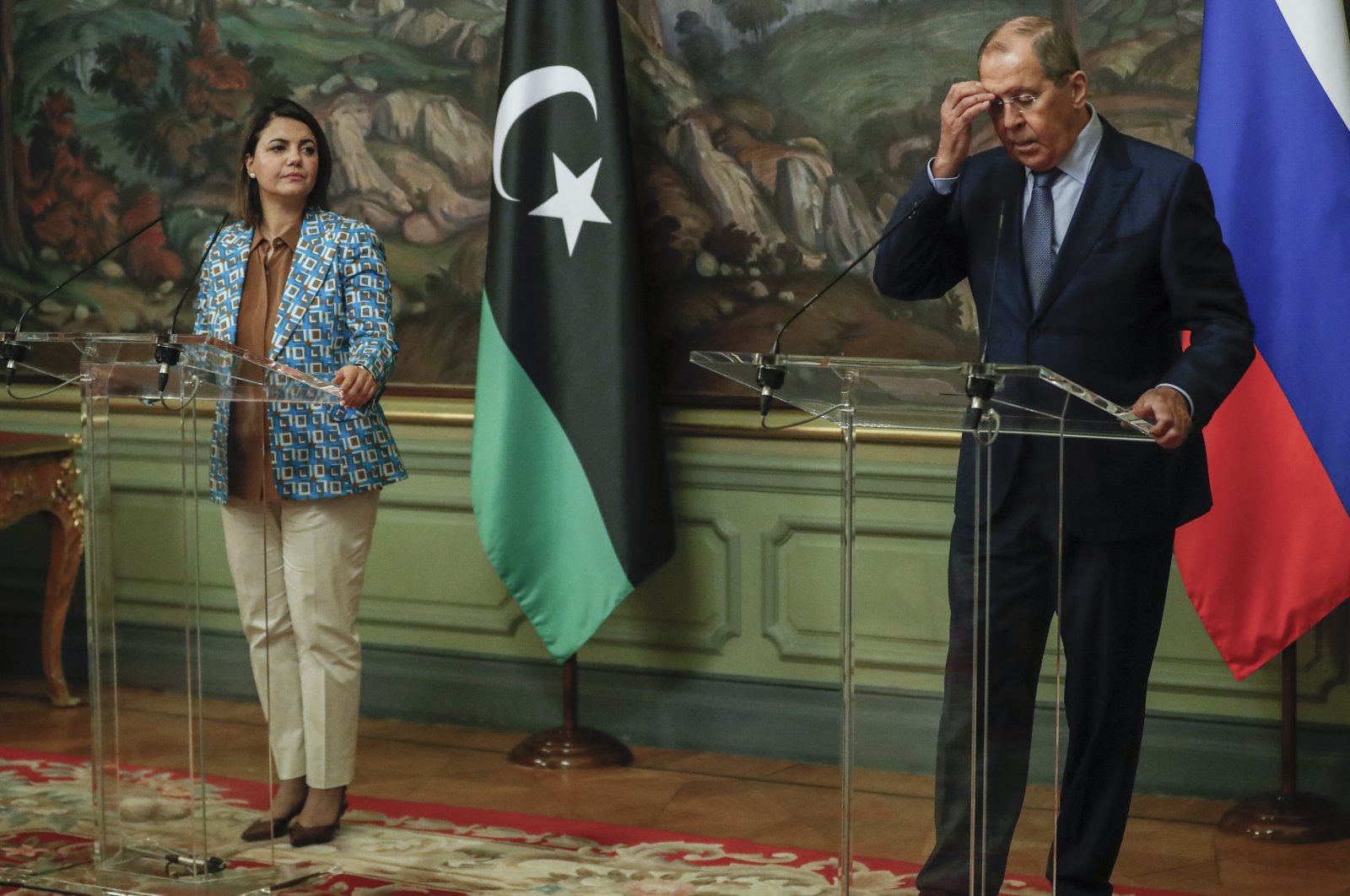 Russian Foreign Minister Sergey and Libyan Foreign Minister Najla Mangoush attend a joint news conference following their talks in Moscow, Russia, Aug. 19, 2021. (Maxim Shipenkov/Pool Photo via AP)