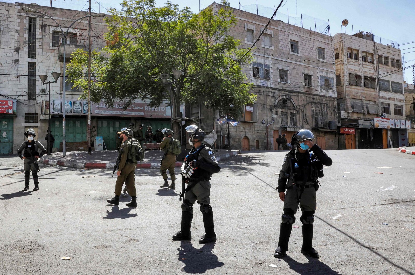 Israeli soldiers stand guard as Israeli forces close down the center of the city of Hebron in the occupied West Bank, Sept. 22, 2021. (AFP Photo)