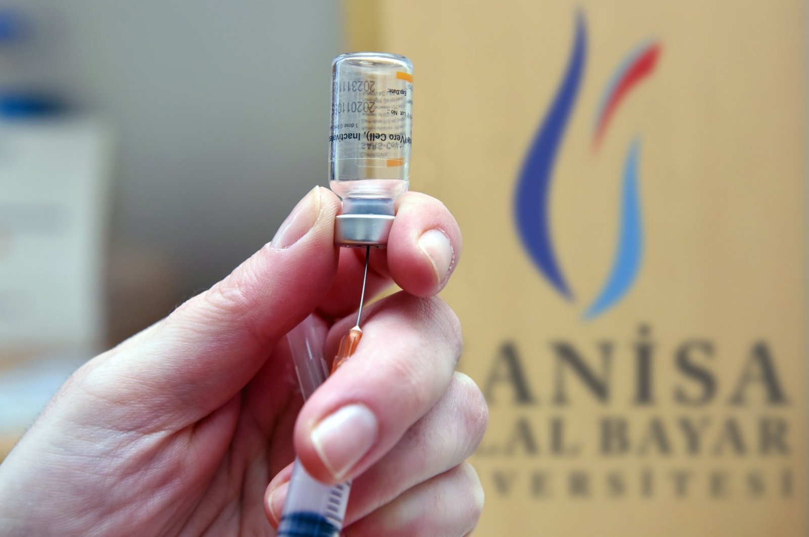 A healtcare worker draws a dose of Sinovac's COVID-19 vaccine into syringe at the Hafsa Sultan Hospital of Manisa Celal Bayar University, in Manisa, Turkey, Sept. 28, 2021. (AA Photo)