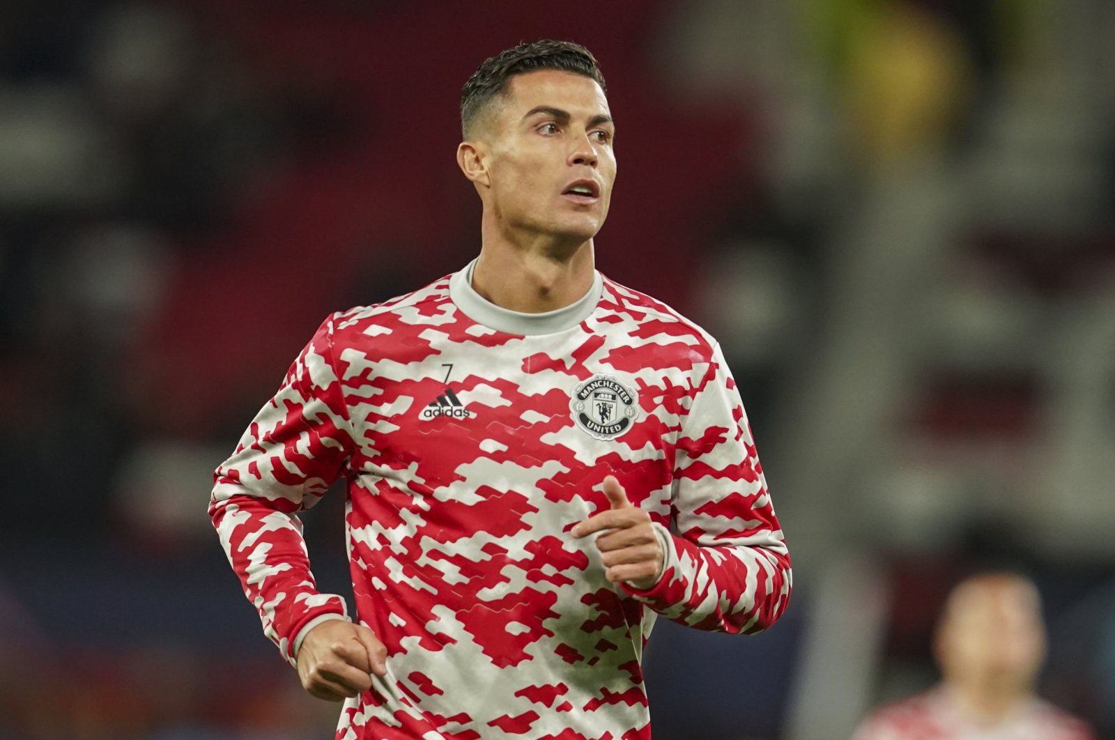 Manchester United's Cristiano Ronaldo warms up ahead of the Champions League Group F soccer match between Manchester United and Villarreal at Old Trafford, Manchester, England, Sept. 29, 2021. (AP Photo)