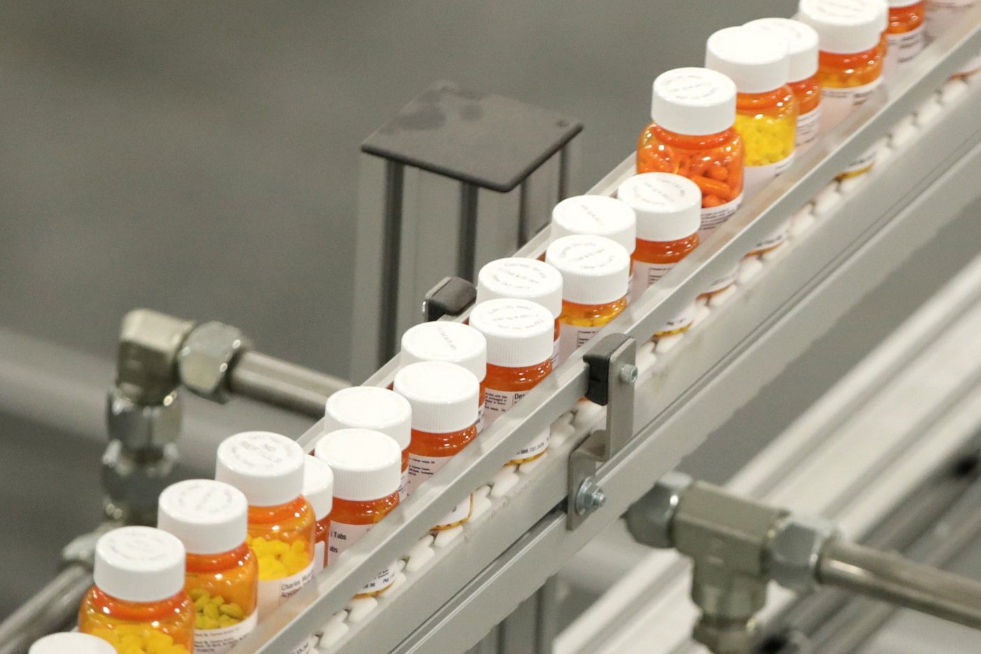 Bottles of medications ride on a belt at a mail-in pharmacy warehouse in Florence, New Jersey, U.S., July 10, 2018. (AP Photo)