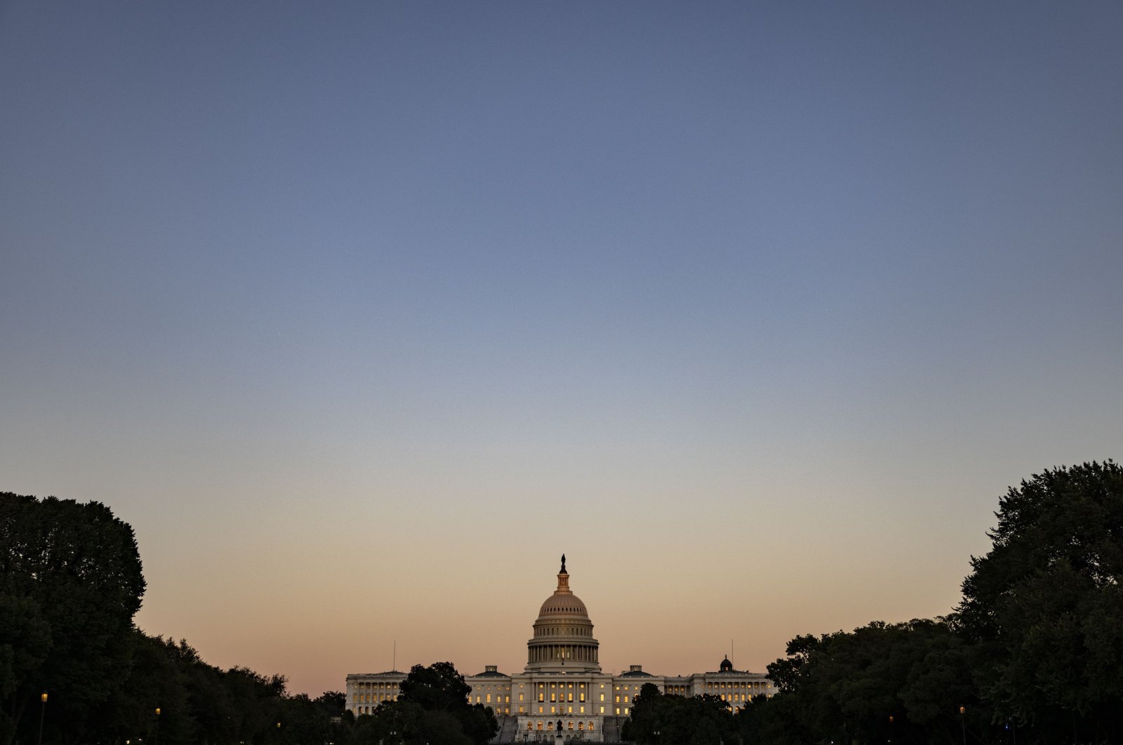 The U.S. Capitol building is seen down the National Mall as the sun sets in Washington, D.C., U.S., Sept. 26, 2021. (AFP Photo)
