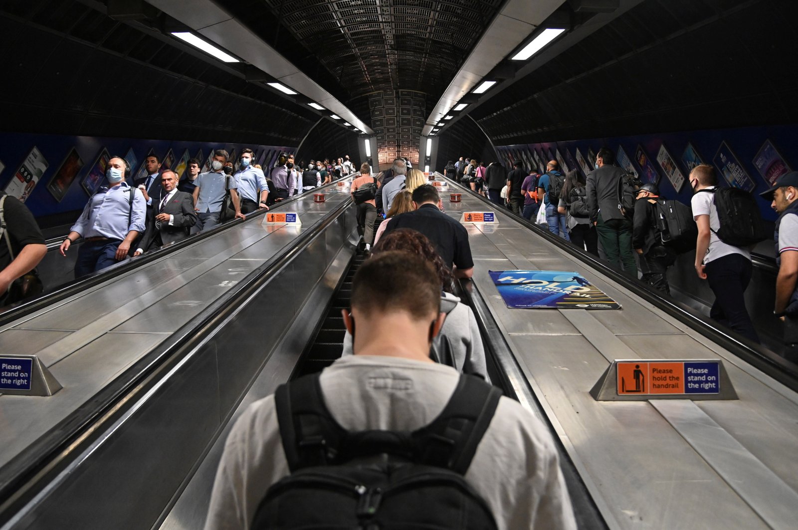 Workers travel through London Bridge rail and underground station during the morning rush hour in London, Britain, Sept. 8, 2021. (Reuters Photo)
