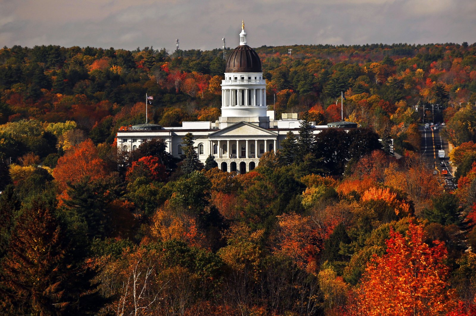 The State House is surrounded by fall foliage in Augusta, Maine, U.S., Oct. 23, 2017. (AP Photo)