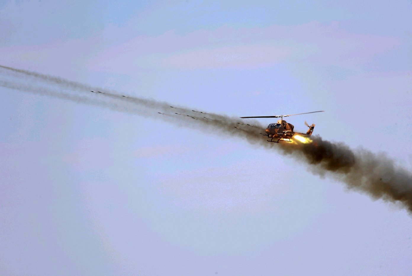An Iranian army helicopter maneuvers during a military exercise in the northwest of the country, close to the Iranian-Azerbaijani border, Oct. 1, 2021. (Iranian Army Office via AFP)