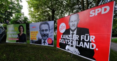 Election posters of the Social Democratic Party's (SPD) candidate for chancellor, Olaf Scholz, Christian Lindner of the liberal Free Democratic Party (FDP) and Greens party co-leader Annalena Baerbock are pictured in a park of Bad Honnef, south of Bonn, Germany, Oct. 1, 2021. (Reuters Photo)