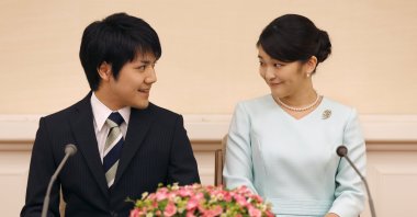 Japanese Princess Mako (R), the eldest daughter of Crown Prince Akishino and Crown Princess Kiko, and her fiancee Kei Komuro (L), a university friend, smile during a press conference to announce their engagement at Akasaka East Residence in Tokyo, Japan, Sep.3, 2017. (EPA/SHIZUO KAMBAYASHI Photo)