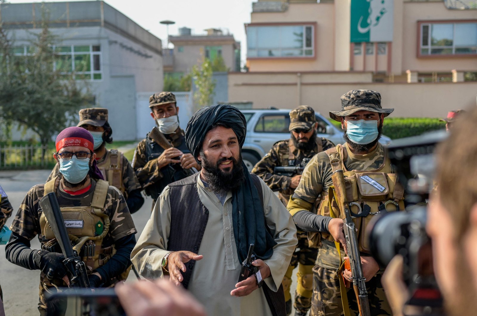 A Taliban commander (C) speaks to members of the media after halting a demonstration by female protestors in front of a school in Kabul, Afghanistan, Sept. 30, 2021. (AFP Photo)