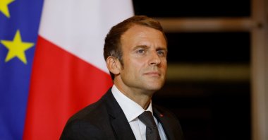 French President Emmanuel Macron reacts as he hosts a dinner at the Elysee Palace as part of the closing ceremony of the Africa2020 Season, which presented the views of the civil society from the African continent and its recent diaspora in different sectors of activity in Paris, France, Sept. 30, 2021.