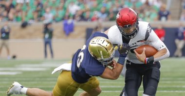 Drew White (40) of the Notre Dame Fighting Irish tries to make the stop on Desmond Ridder (9) of the Cincinnati Bearcats during the second half at Notre Dame Stadium, South Bend, Indiana, U.S., Oct. 2, 2021. (AFP Photo)