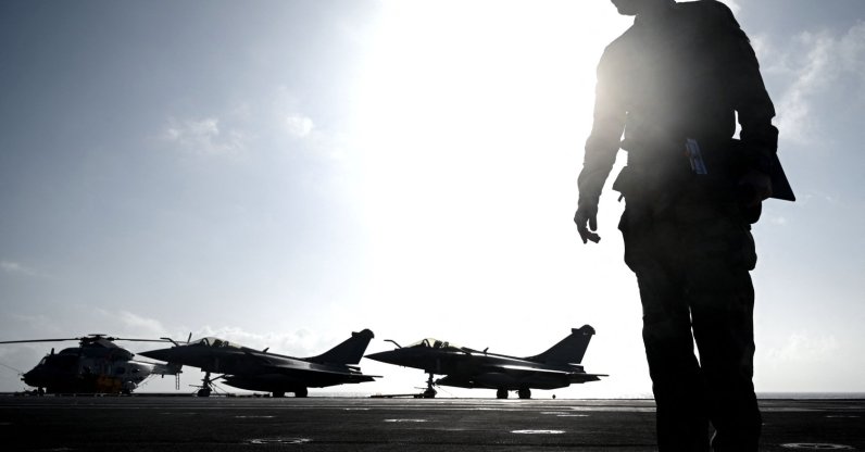 A military officer looks on in front of Rafale jet fighters on the deck of the French aircraft carrier “Charles de Gaulle” at sea, off the coast of Hyeres, Jan. 23, 2020 (AFP File Photo)