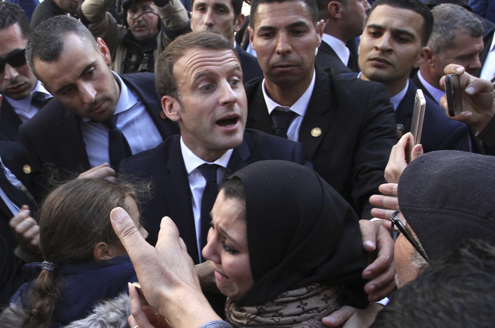 French President Emmanuel Macron meets residents in Algiers, Algeria, Dec. 6, 2017. (AFP Photo)