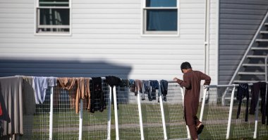 An Afghan refugee stands outside temporary housing at Ft. McCoy U.S. Army base, Sept. 30, 2021, Wisconsin, U.S. (AFP Photo)