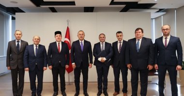 Foreign Minister Mevlüt Çavuşoğlu (C) meets with members of the Muslim Religious Union in Poland, Warsaw, Poland, Oct. 4, 2021. (AA Photo)