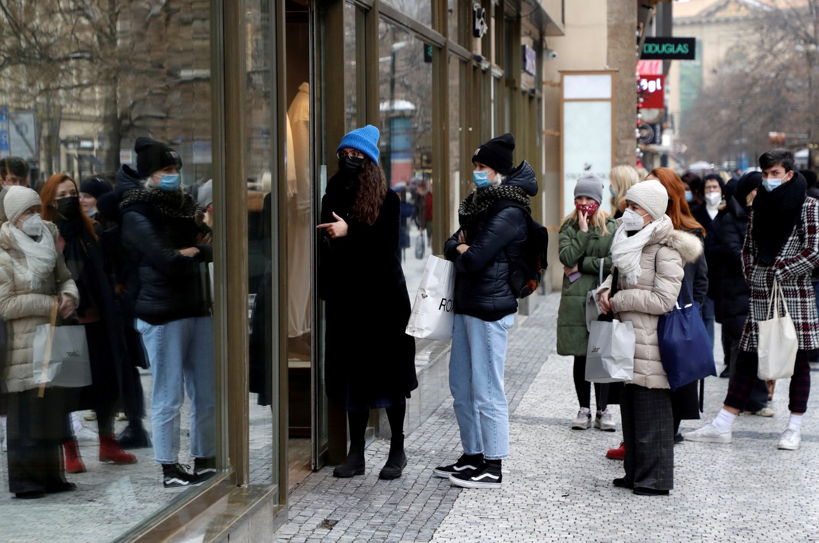 Customers queue in front of the reopened shop, as restrictions ease following the coronavirus outbreak in Prague, Czech Republic, Dec. 3, 2020. (Reuters Photo)