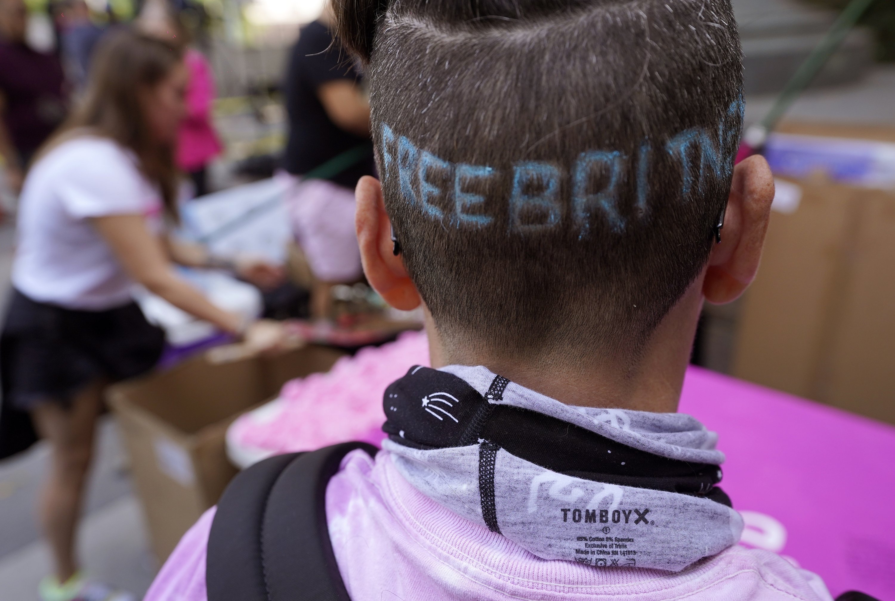 Britney Spears supporter Kim Van Doorn of Bakersfield, Calif., shows off a 'Free Britney' design in her hair outside the Stanley Mosk Courthouse, Sept. 29, 2021, Los Angeles, U.S. (AP Photo)