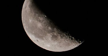 The waning crescent moon is seen in the night sky from Berlin's Kreuzberg district on Sep. 30, 2021. (AFP Photo)