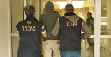Police escort a captured FETÖ suspect, in Samsun, northern Turkey, Sept. 23, 2021. (İHA PHOTO) 