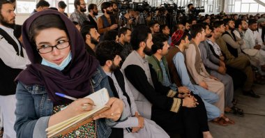 An Afghan female journalist attends a Taliban news conference where they announced they will start issuing passports to Afghan citizens again following months of delays that hampered attempts by those trying to flee the country after the Taliban seized control, in Kabul, Afghanistan, Oct. 5, 2021. (Reuters Photo)