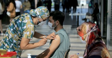 Barış Kaya, a student, gets vaccinated at a university campus in Kırklareli, northwestern Turkey, Oct. 5, 2021. (AA PHOTO)