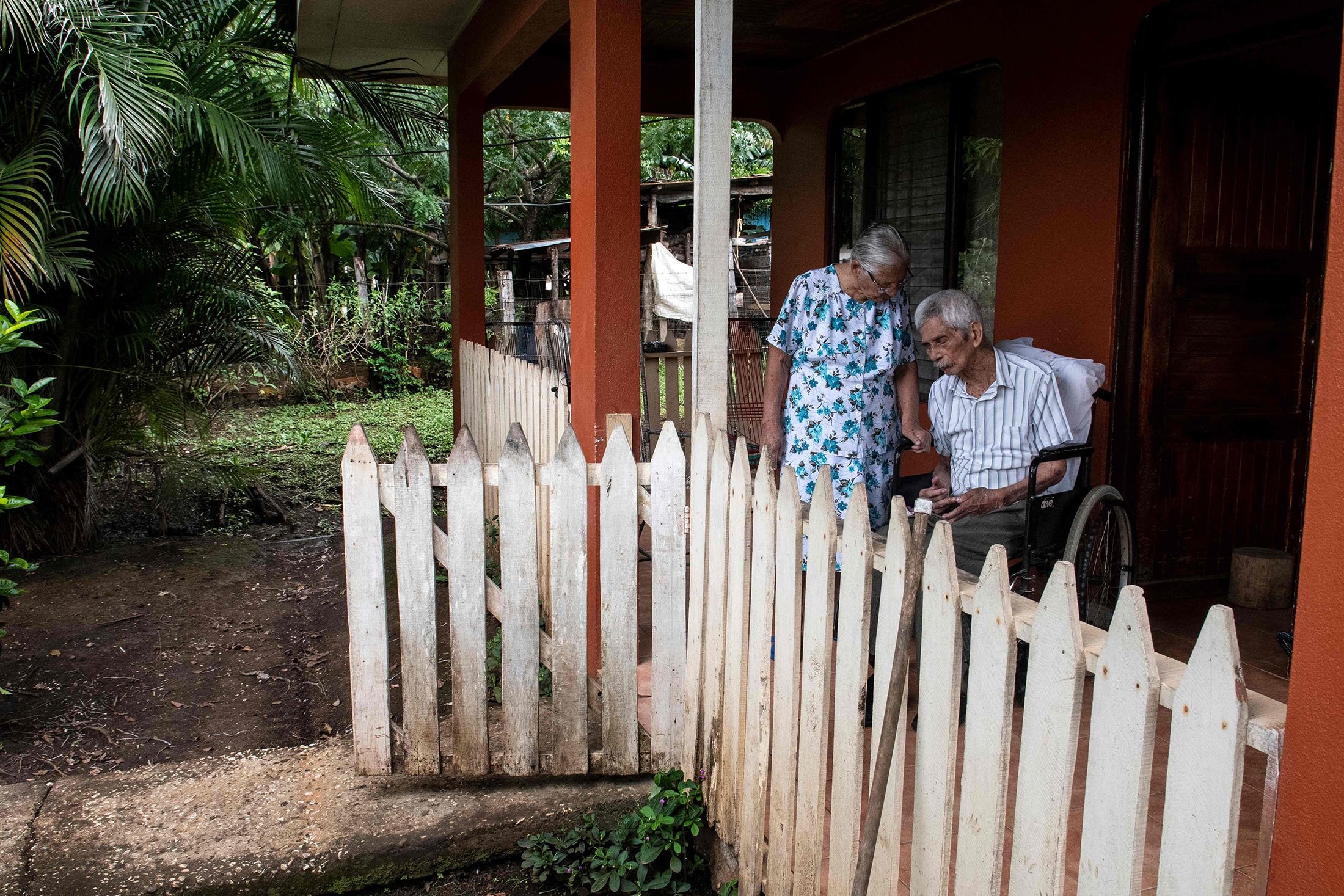Clementina Espinoza (L), 92, and her husband Agustin Espinoza, 100, are seen outside their home in Nicoya, Costa Rica, Aug. 27, 2021. (AFP Photo)