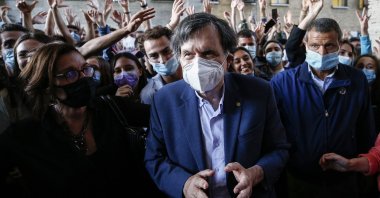 Italian physicist Giorgio Parisi is cheered by students as he arrives at the Sapienza University, in Rome, Italy, Oct. 5, 2021. (AP Photo)