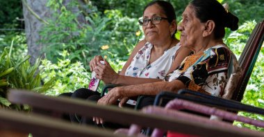 Natividad “Talia” Matarrita Fonseca (R), 93, sits next to her sister Sara Fonseca at their home in Nicoya, Costa Rica, Aug. 28, 2021. (AFP Photo)