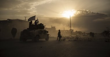 Taliban fighters ride atop a Humvee on the way to detain Afghans involved in a street fight in Kabul, Afghanistan, Sept. 21, 2021. (AP Photo)