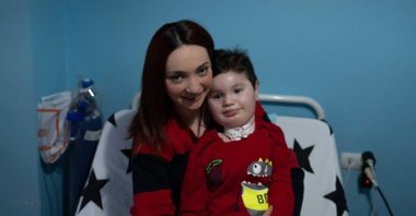 Ece Soyer Demir, who campaigned for free SMA tests for couples, poses with her son Çağan Meriç who has the illness, in Eskişehir, central Turkey, Nov. 15, 2020. (AA PHOTO)