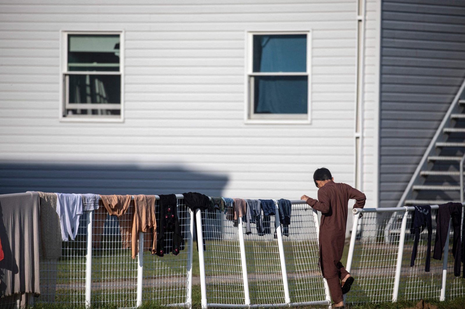 An Afghan refugee stands outside temporary housing at Ft. McCoy U.S. Army base, Sept. 30, 2021 in Ft. McCoy, Wisconsin, U.S. (AFP Photo)