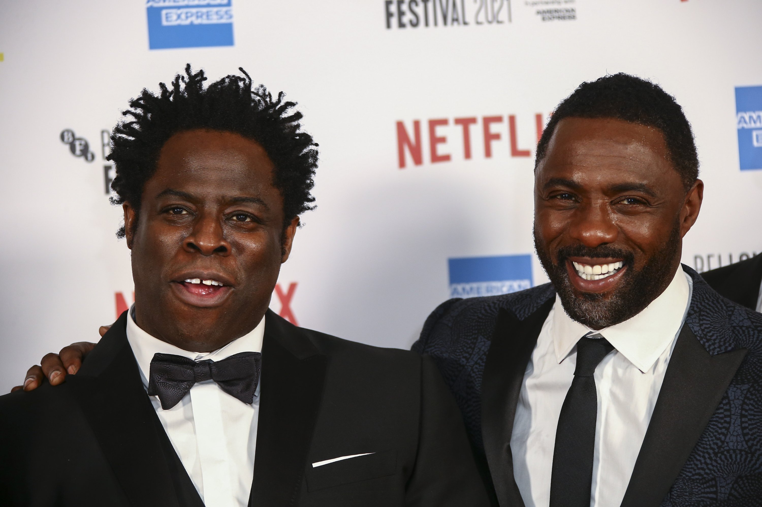 Idris Elba (R) and Jeymes Samuel pose for photographers upon arrival at the opening of the London film festival and the World premiere of the film "The Harder They Fall" in London, Oct. 6, 2021. (AP)