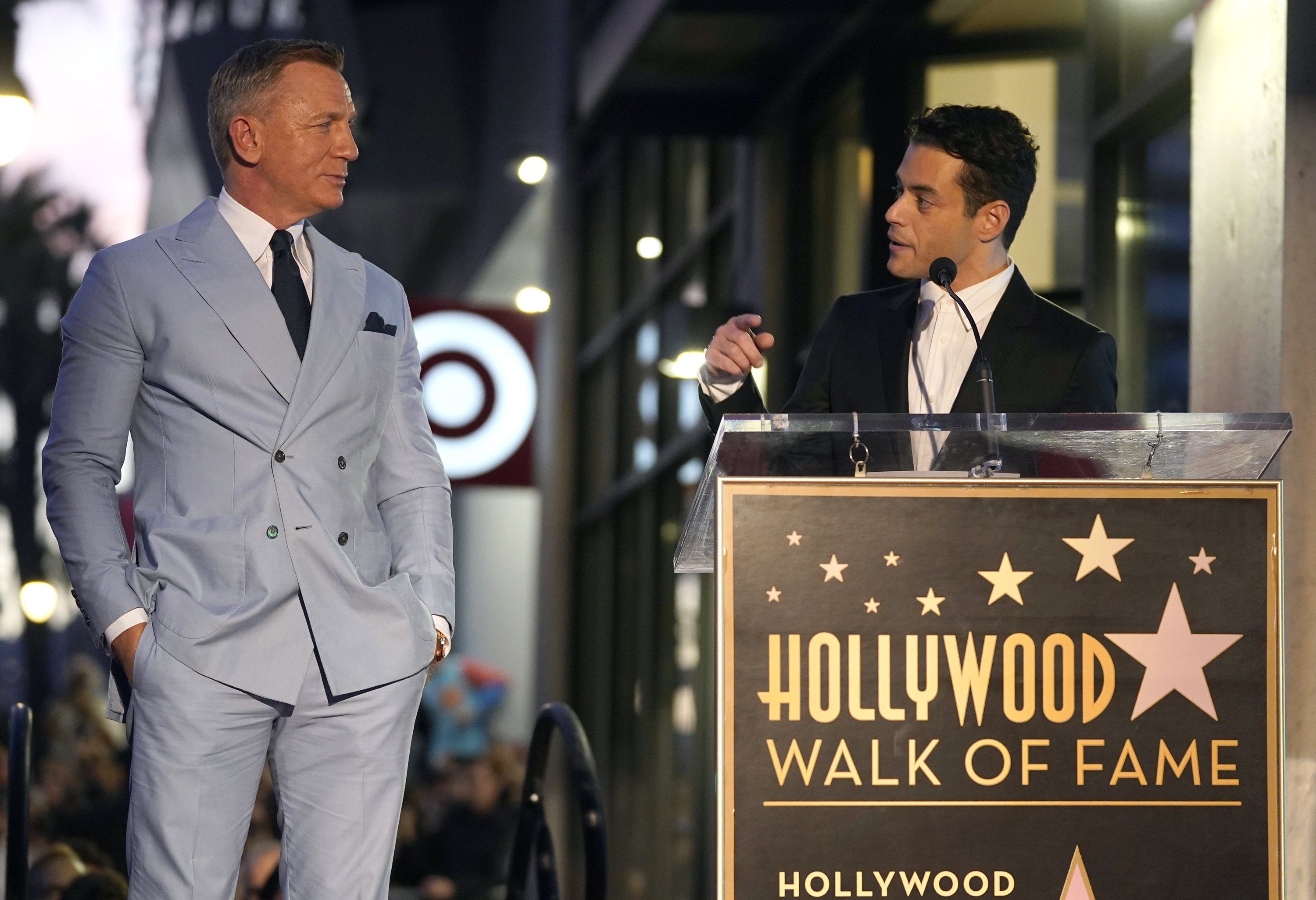Rami Malek speaks as Daniel Craig looks on during a ceremony honoring Craig with a star on the Hollywood Walk of Fame, Los Angeles, California, U.S., Oct. 6, 2021. (AP Photo)
