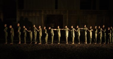 Drug users detained during a Taliban raid walk in line on their way to the detoxification ward of the Avicenna Medical Hospital for Drug Treatment in Kabul, Afghanistan, Oct. 2, 2021. (AP Photo)