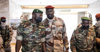 President of the National Committee for Rally and Development (CNRD) Col. Mamady Doumbouya (C) leaves a meeting with high-level representatives of the Economic Community of West African States (ECOWAS) in Conakry, Guinea, Sept. 17, 2021,  (AFP Photo)